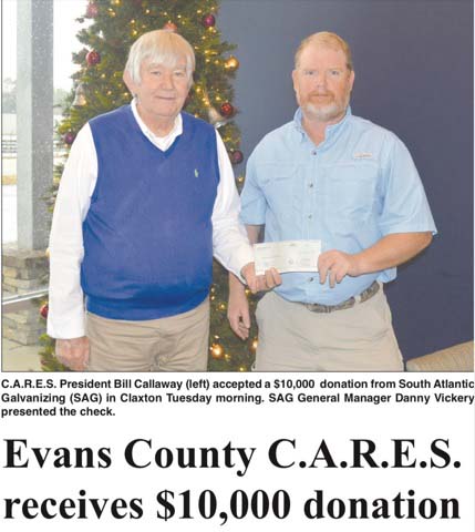 Representative from The Evans County CARES Organization Receiving a Check From South Atlantic LLC