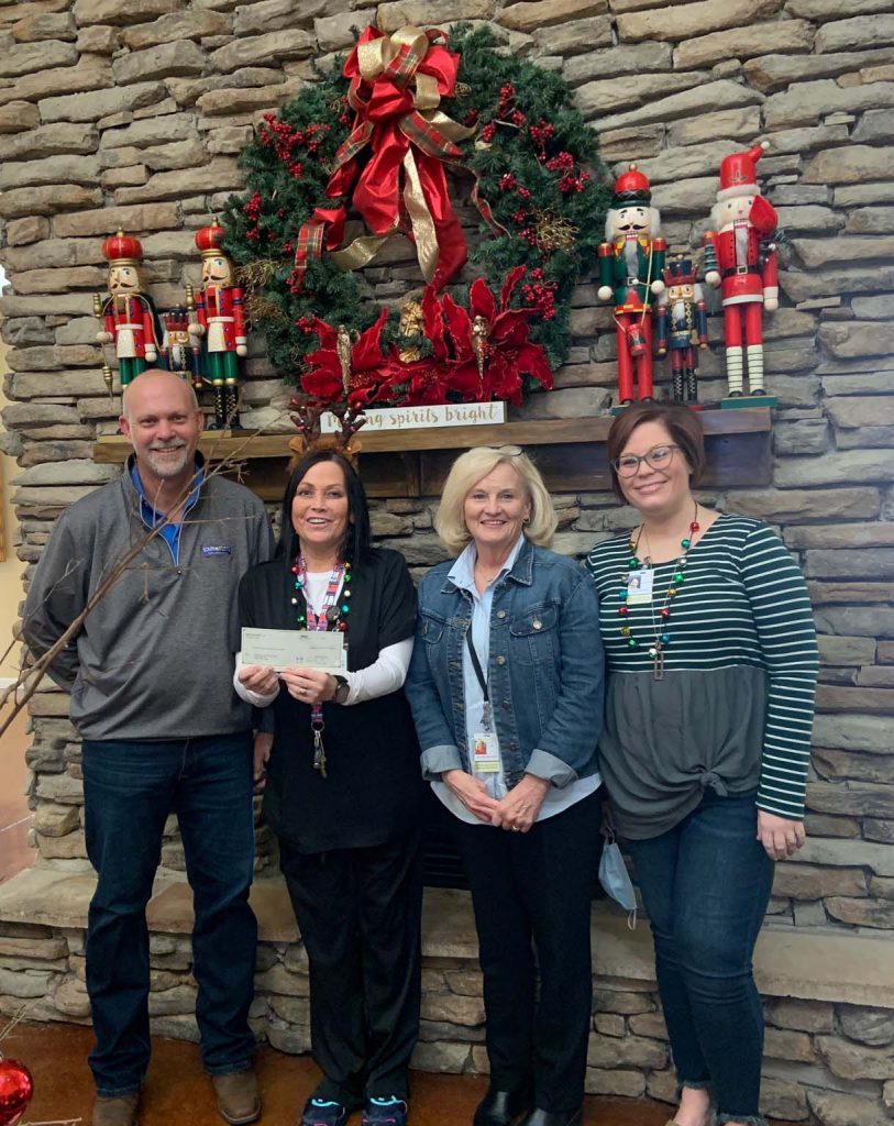 Representatives from The Sanctuary Hospice House Receiving a Check From South Atlantic LLC