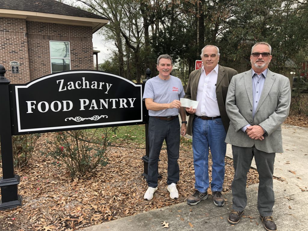Representatives from The Zachary Food Pantry Receiving a Check From South Atlantic LLC