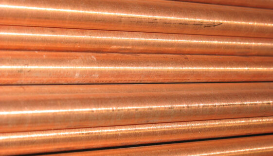 Closeup On Copper Rods Lined Up Together. How Long Do Copper Ground Rods Last?