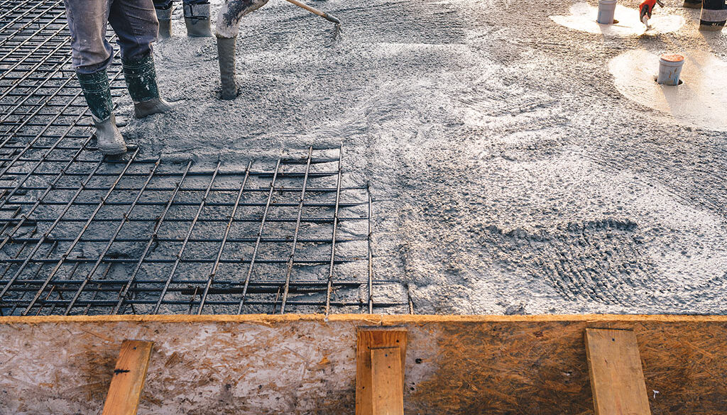 Construction Workers Pouring Concrete on Top of Reinforced Rebar at a Job Site Hot Dip Galvanized Rebar Effects