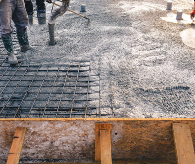 Construction Workers Pouring Concrete on Top of Reinforced Rebar at a Job Site Hot Dip Galvanized Rebar Effects