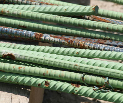 Closeup of a Bundle of Green Rusting Epoxy-Coated Rebar Galvanized vs. Epoxy-Coated Rebar