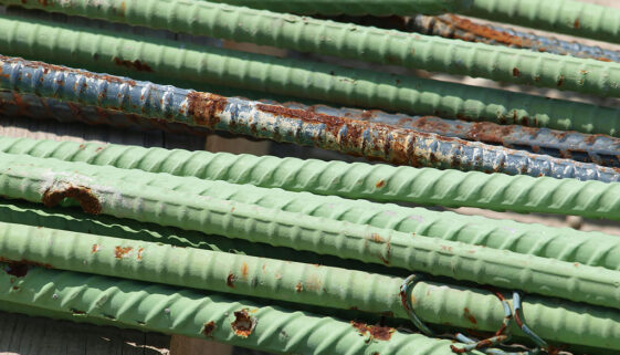 Closeup of a Bundle of Green Rusting Epoxy-Coated Rebar Galvanized vs. Epoxy-Coated Rebar