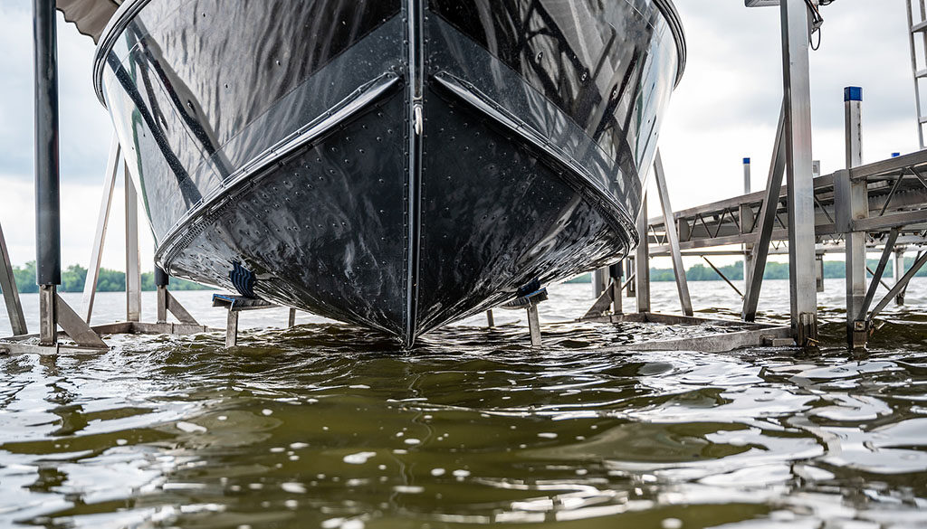 Closeup Of A Boat Being Lifted Out Of A Lake By A Hydraulic Boat Life Rust Prevention