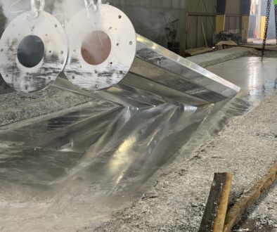 Closeup Of A Steel Beam Being Dipped In A Zinc Bath Hot Dip vs. Electro-galvanizing