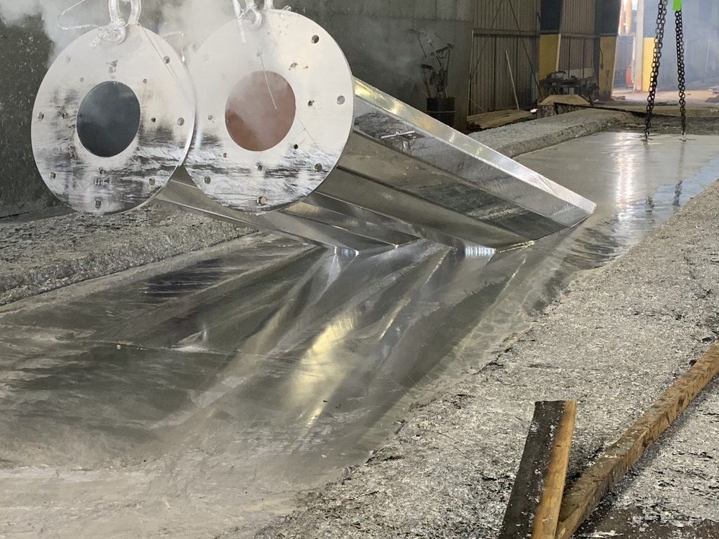 Closeup Of A Steel Beam Being Dipped In A Zinc Bath Hot Dip vs. Electro-galvanizing