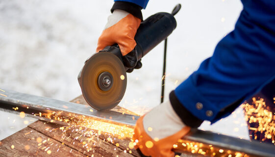 Closeup Of An Industrial Worker Using A Saw To Cut A Steel Bar Can You Cut Galvanized Steel