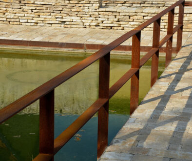 Closeup Of A Handrail Made From Weathering Steel Above Water Galvanized Vs Weathering Steel