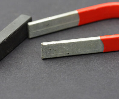 Closeup Of A Horseshoe Magnet Beside A Magnet Block Is Galvanized Steel Magnetic