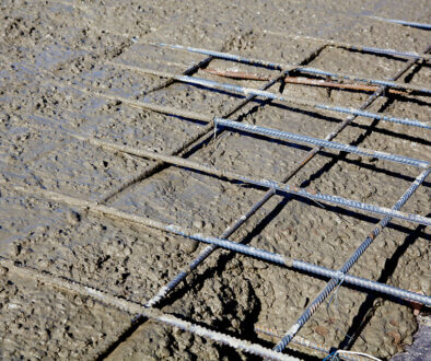 Closeup Of Freshly Poured Concrete On Top Of Galvanized Rebar How Does Galvanized Rebar React In Concrete