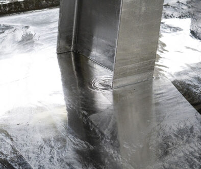 Closeup Of A Steel Beam Being Dipped In A Zinc Bath Types Of Steel